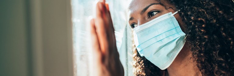 woman inside wearing mask