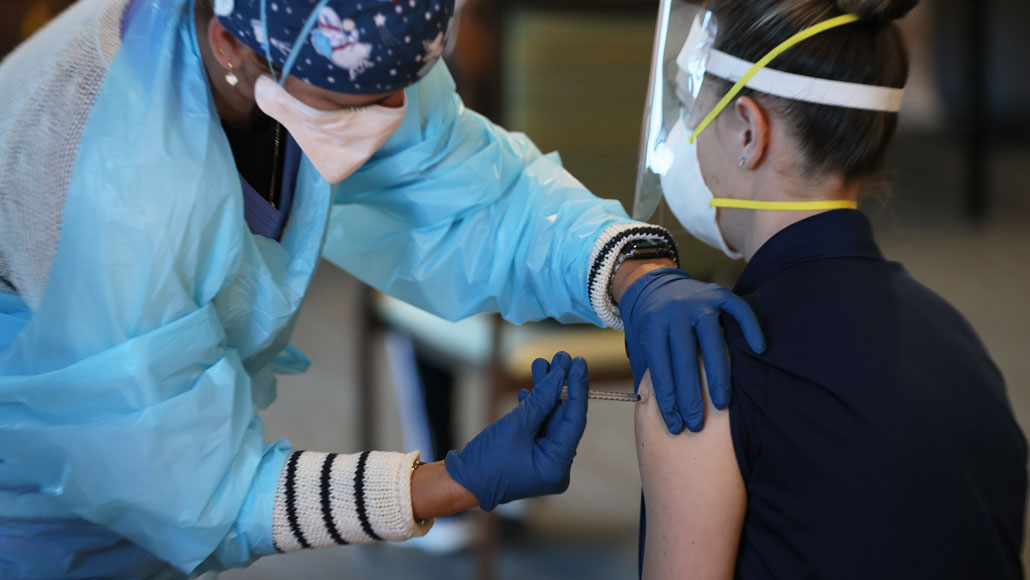 health care worker receives vaccine