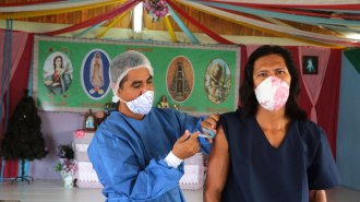 Baré person getting Sinovac COVID-19 vaccine