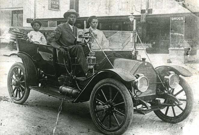 black and white image of the Williams family in a nice car
