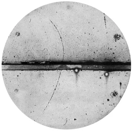 black and white image of positron particle track