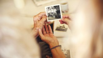 Women looking at an old photograph
