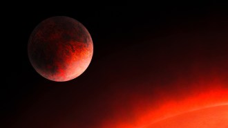 illustration of exoplanet GJ 367b next to a glowing red star