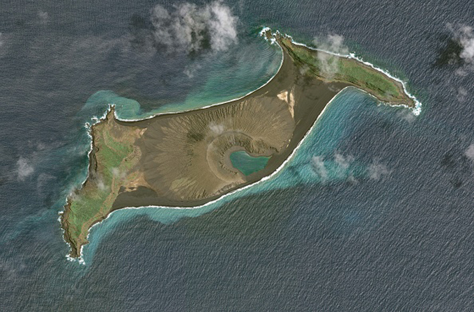 Image slider comparing the land bridge between Hunga Tonga and Hunga Ha'apai before and after the recent volcanic eruption. The before image shows a volcanic cone connecting the islands; the after shows the cone has vanished and the island has sunk.
