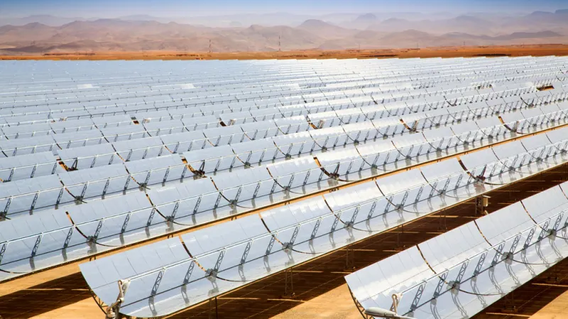 A solar thermal power plant in Morocco, with long rows of solar panels