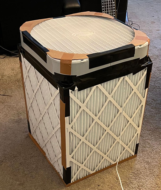 A homemade Corsi-Rosenthal box, with a box fan on top and several air filters on either side