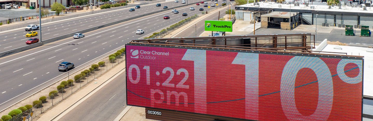 A photo of a temperature board in Phoenix, Arizona showing 110 degrees and the time 1:22 p.m.