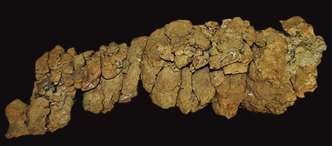 A photo of a pile of rocks on a black background.