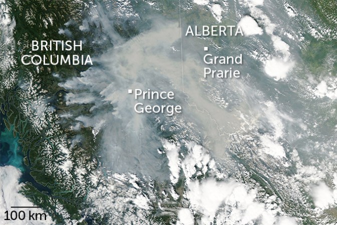 A satellite image of western Canada with smoke blanketing large swaths of British Columbia and Alberta