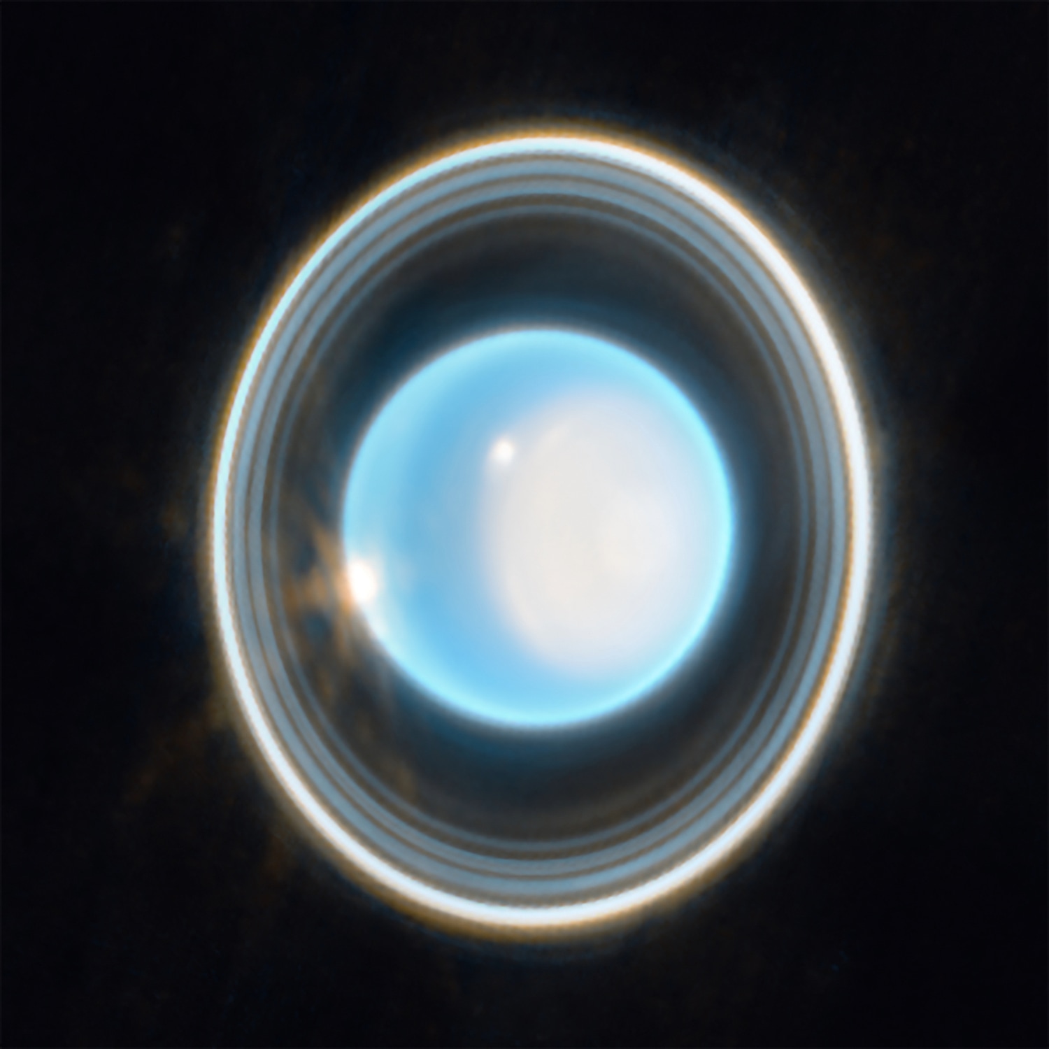 Rings encircle a blue planet with several bright white spots in its atmosphere.