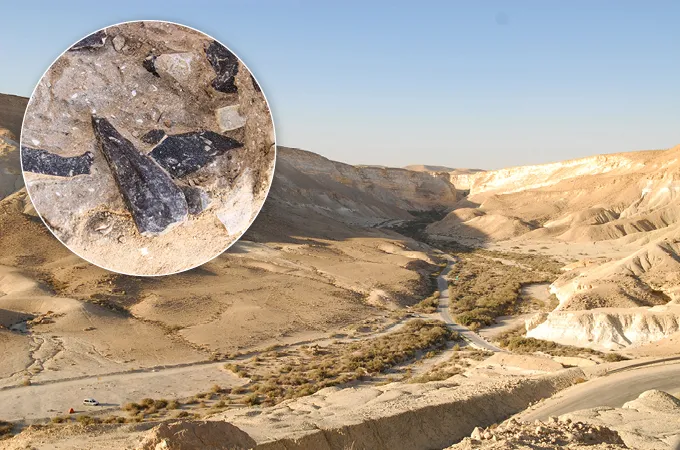 A dry-looking landscape that was the site of some key artifacts (pointed stones shown in a circle inset at the top left of the picture) that point to a cultural shift.