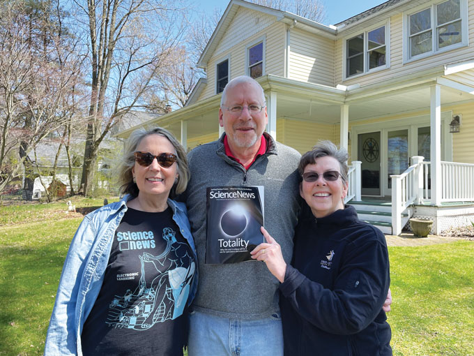 Nancy Shute poses with readers Paul and Kathy Mathews and a copy of a Science News magazine