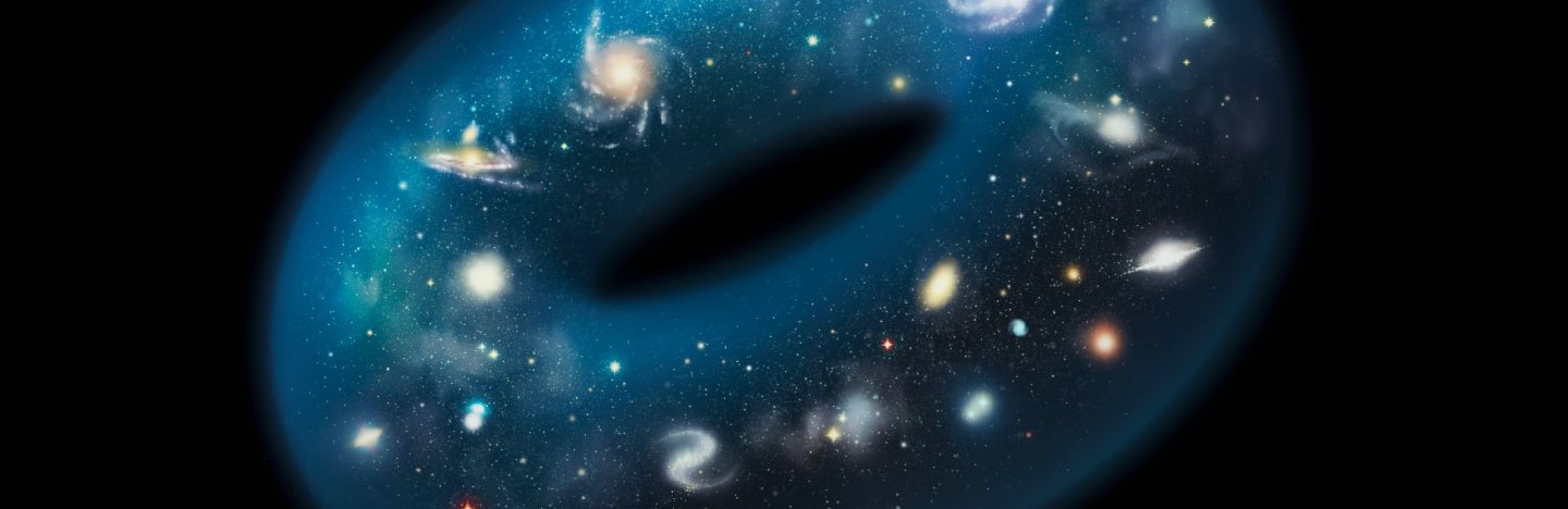 An illustration shows a doughnut shape filled with galaxies