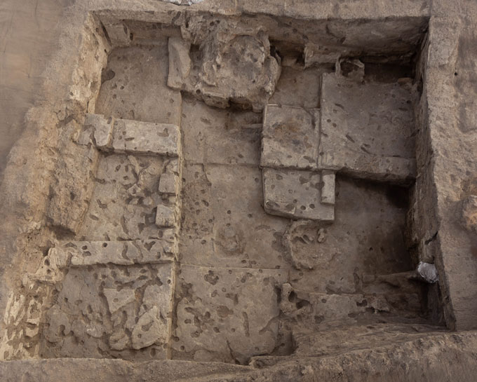 Stone blocks at slightly different levels fill a stone pit