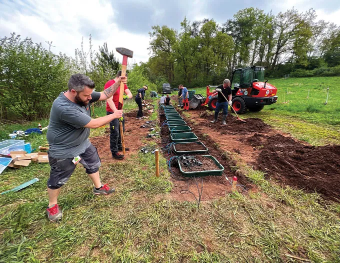 A photograph of researchers instalingl devices for measuring the weathering process