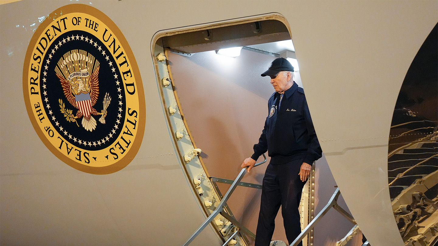 President Joe Biden walks off Air Force One, the presidential plane