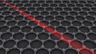 This illustration of a sheet of graphene shows a grid of connected atoms with a red streak going diagonally across it.