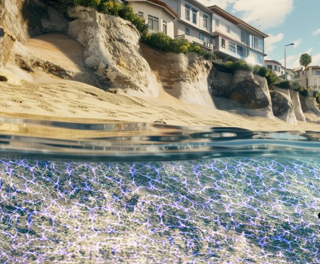 This illustration shows a web of blue lines in the water along a shoreline in which houses perch on sandy cliffs above. The blue illustrates the use of low voltage electricity to turn sand into stone and protect the coast against erosion.