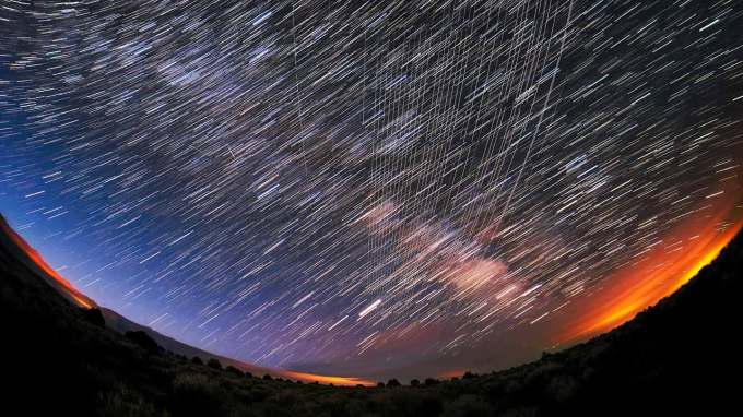 A timelapse image of satellite tracks in the sky.