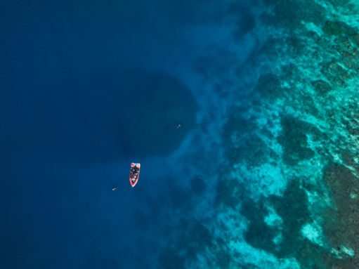 an aerial view of a boat at sea