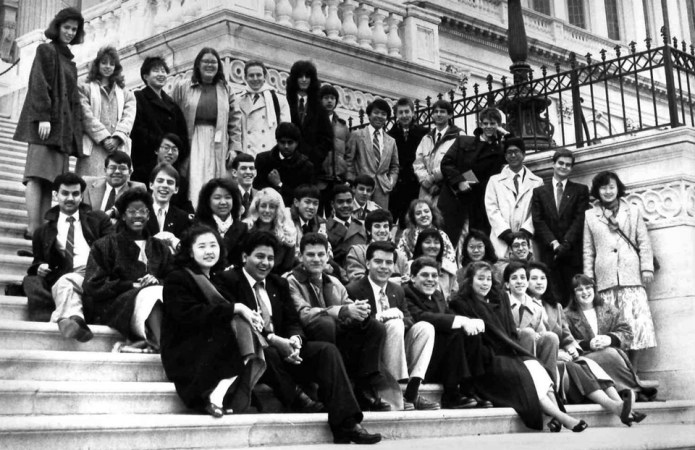 Finalists of the 1988 Science Talent Search sit and stand on the steps of the U.S. Capitol.