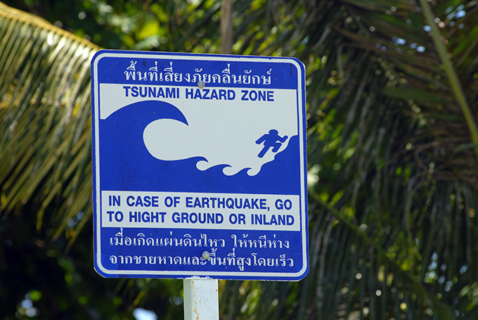 A photograph of a tsunami hazard zone sign.