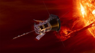 Illustration of a roughly cylindrical spacecraft near the sun. The sun is emitting a large coronal loop.