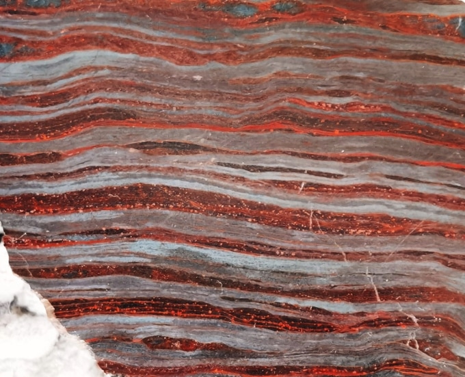 Red and gray bands in a 3.5-billion-year-old rock formation.