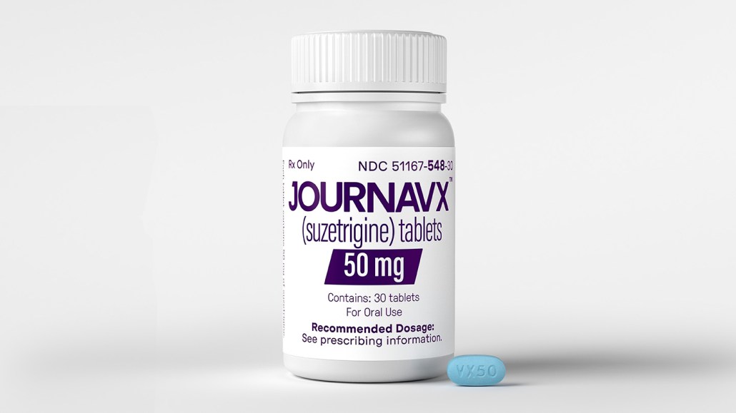 An image of a pill bottle labeled JOURNAVX with a little blue pill beside it.