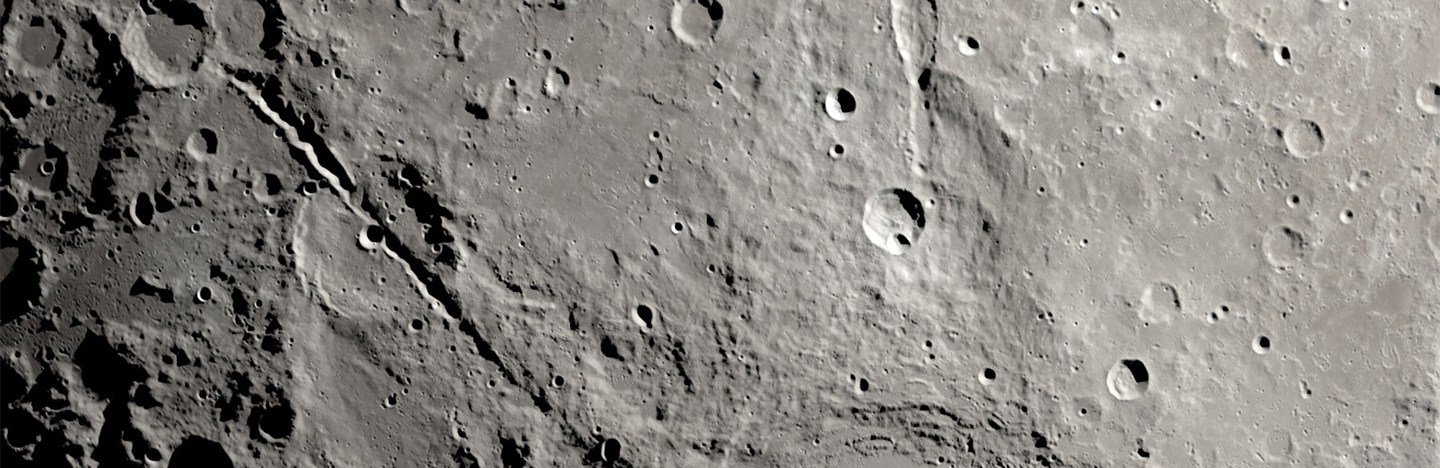 Close-up of the surface of the moon from above.