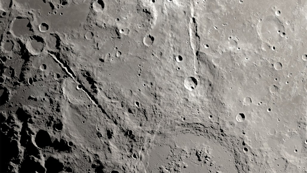 Close-up of the surface of the moon from above.