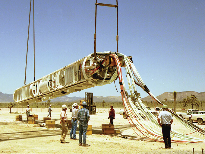 A rack of metal and wires used for nuclear explosion diagnostics is suspended in the air.