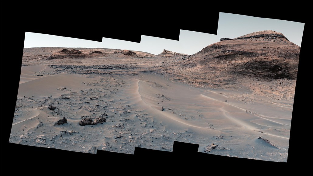 An image taken by NASA's Curiosity rover shows a mountain, dunes and an ancient lakebed on Mars.