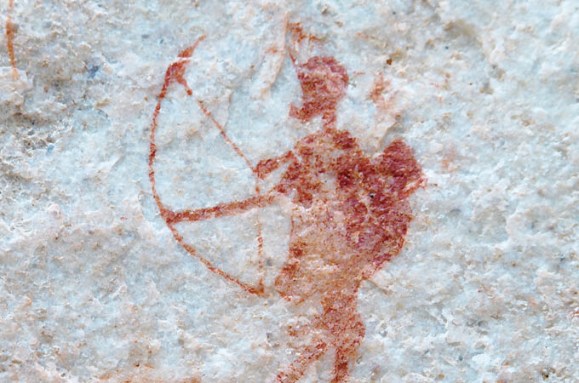 A red drawing of a person using a bow and arrow.