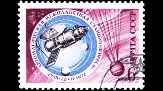 A pink postage stamp with Russian letters, the date 1972, and a blue circular inset highlighting an illustration of a spacecraft.
