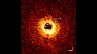 This image shows a star, center, whose light is blocked so that the surrounding dust rings are visible. Three are labeled and a spot on the edge of one is marked with concentric circles to denote the location of a purported exoplanet spotted by the Webb telescope.