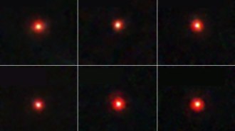 Six-panel image showing red dots against a black background, each a distant galaxy observed in infrared.