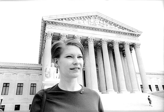 A photo of Susan Epperson in front of a building.