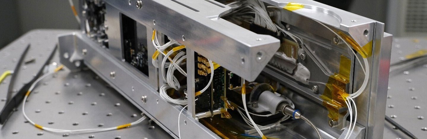 Quantum computer hardware is shown on a laboratory table