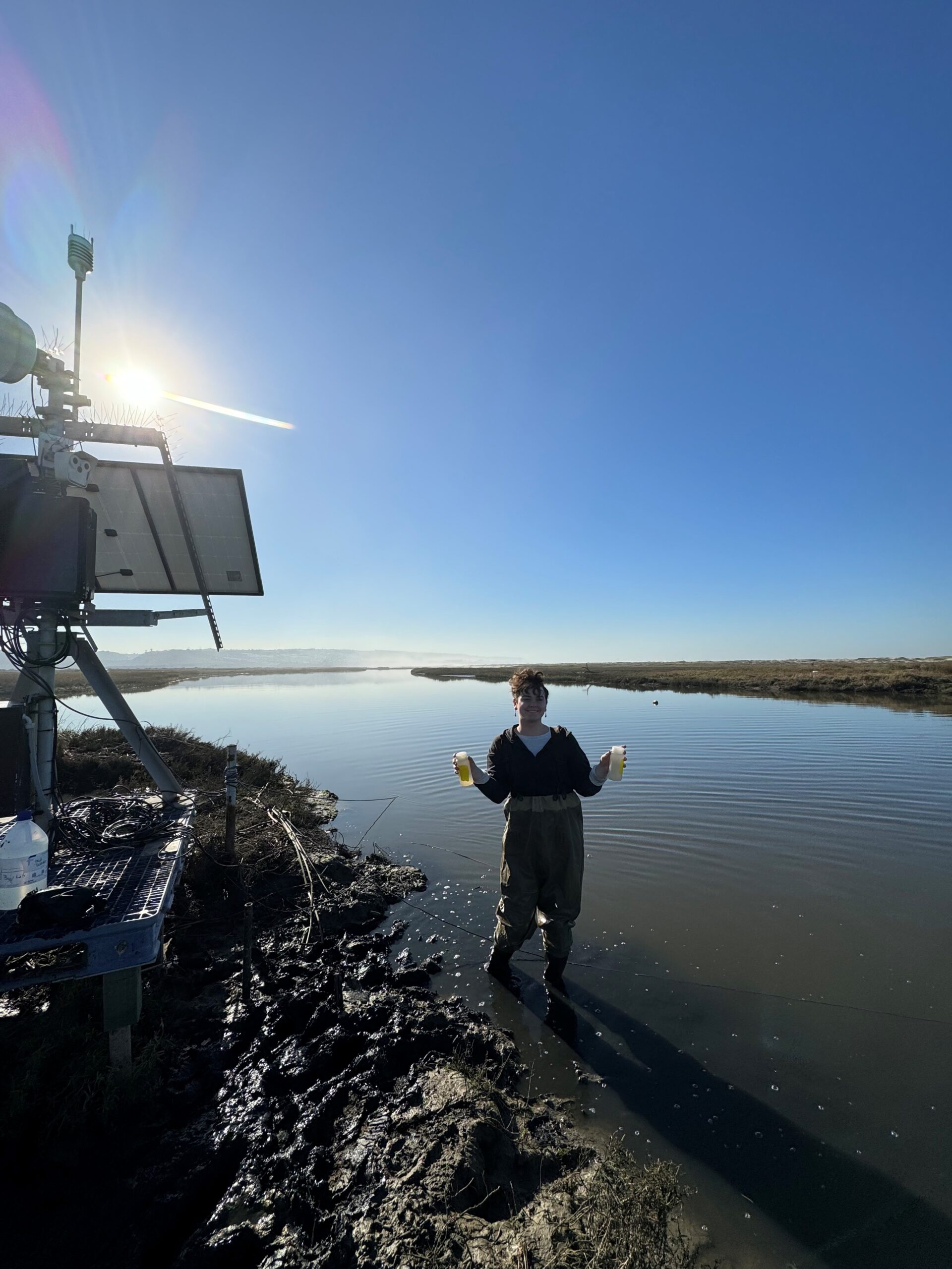  Oceanographer Eva Scrivner routinely collects water samples from a river to test for the presence of harmful bacteria.
