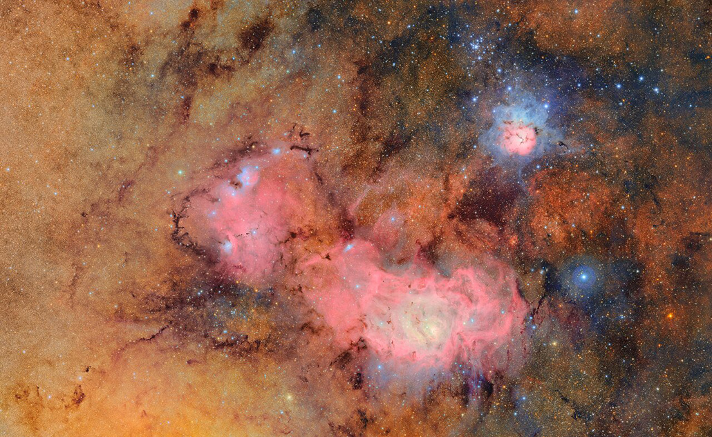 An image taken from the Rubin Observatory of the Trifid and Lagoon nebulas