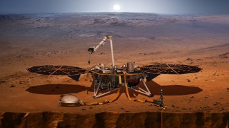 Illustration of NASA's InSight lander sitting on Mars' surface with instruments deployed.