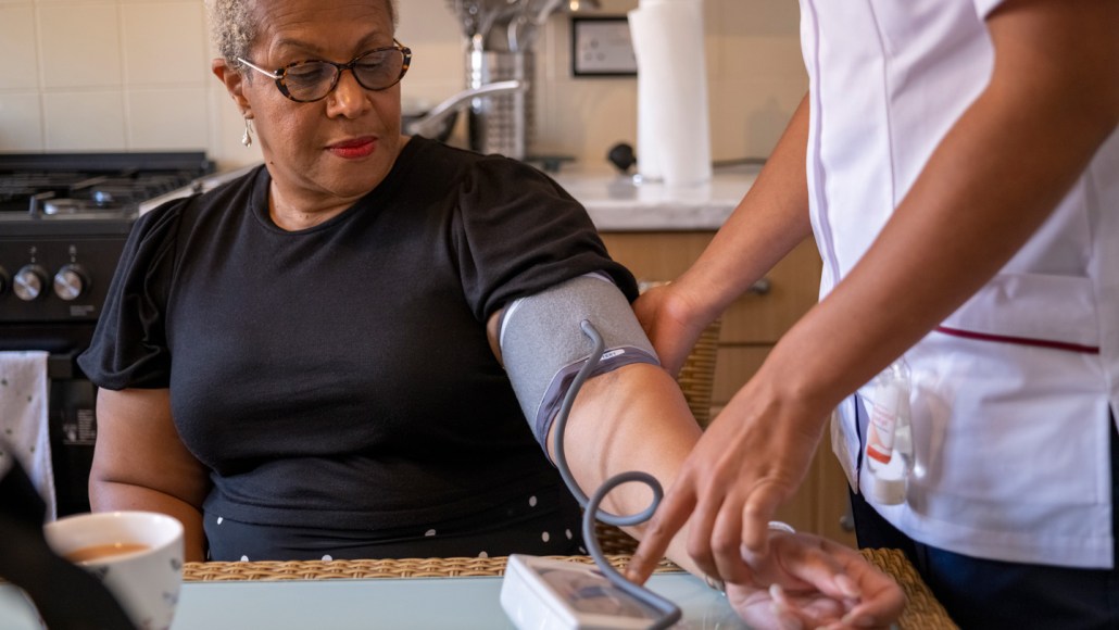 A woman getting her blood pressure taken.