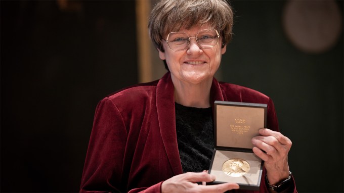 Nobel Prize winner Katalin Karikó is shown holding her gold medal.
