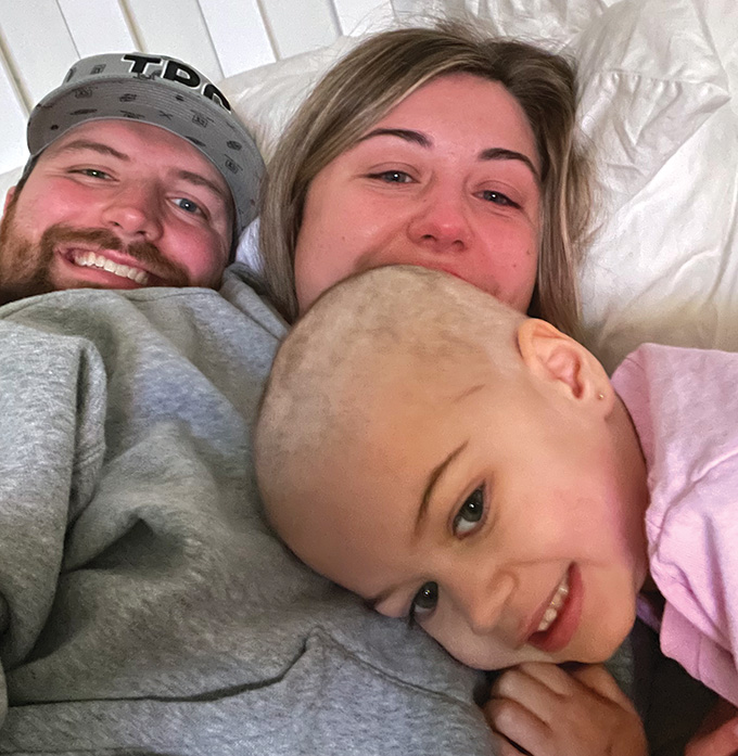 A photo of Charlie Stenson with her parents