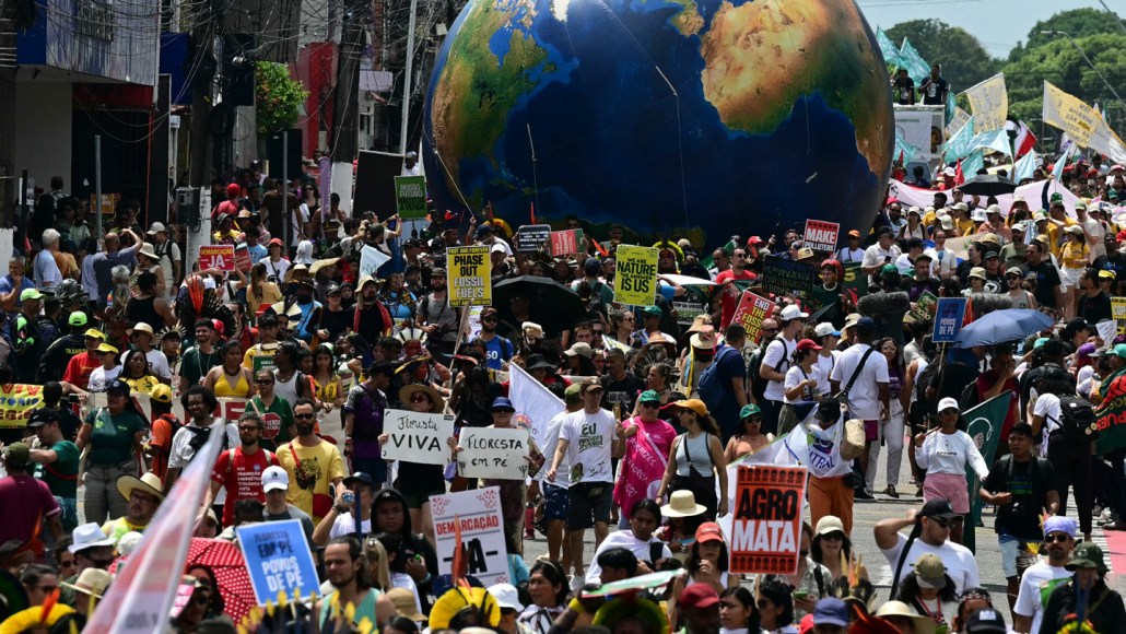 Protestors march outside of COP30 in Brazil