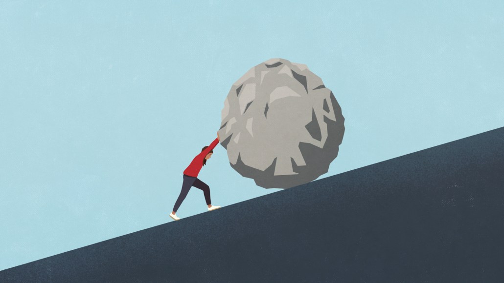 An illustration of a person pushing a large boulder up a steep hill.