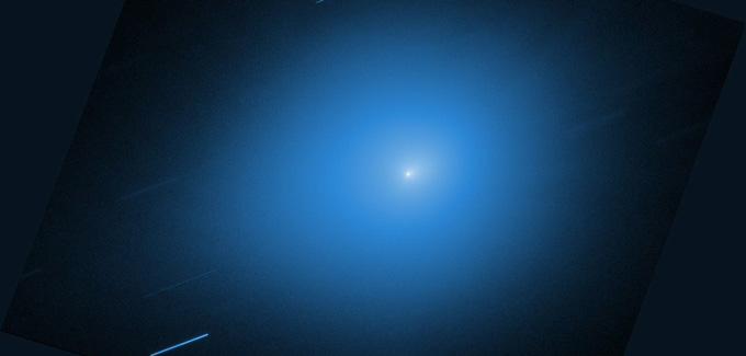 A bright spot of light is seen illuminating a dark area around it.