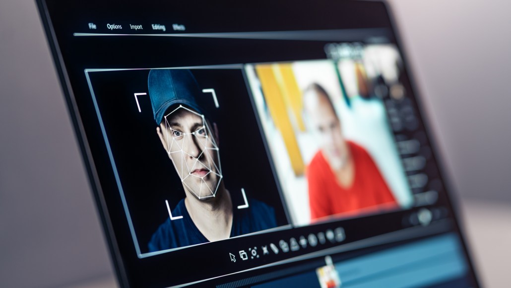 A computer screen showing how deepfakes are made transfer a face onto another body