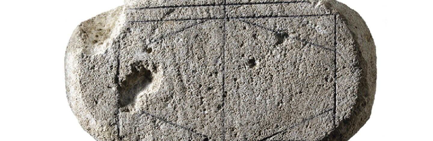 A game “board” on a piece of limestone solved by AI